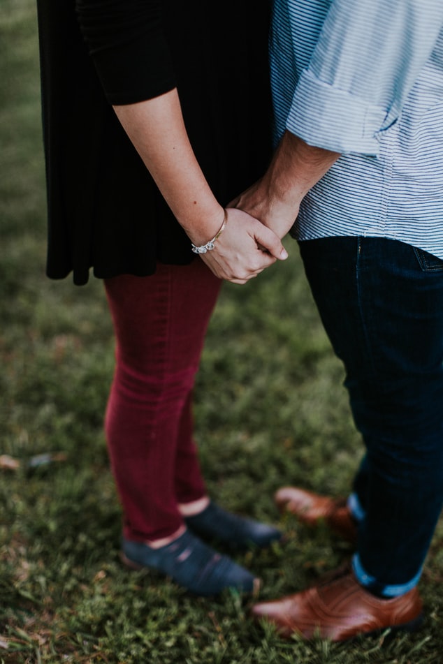 two lovers holding hands together