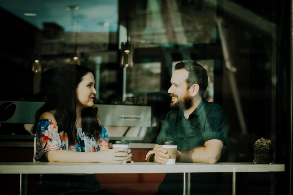 a lady and a man having a conversation and asking questions