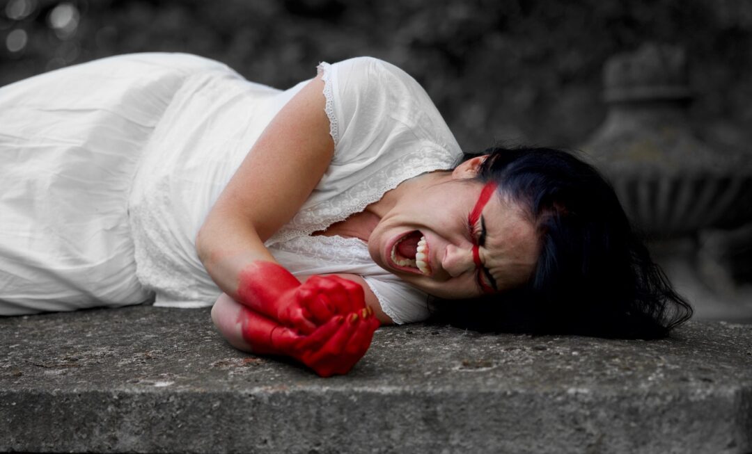 a woman stained with blood after a miscarriage