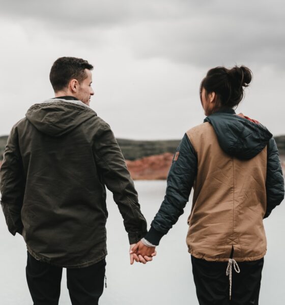 two friends holding each other hands
