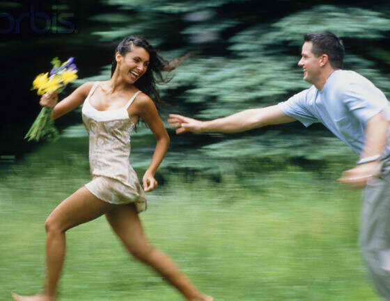 man chasing woman